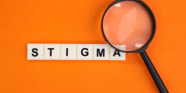 magnifying glass with the word Stigma. a mark of disgrace associated with a particular circumstance, quality, or person.